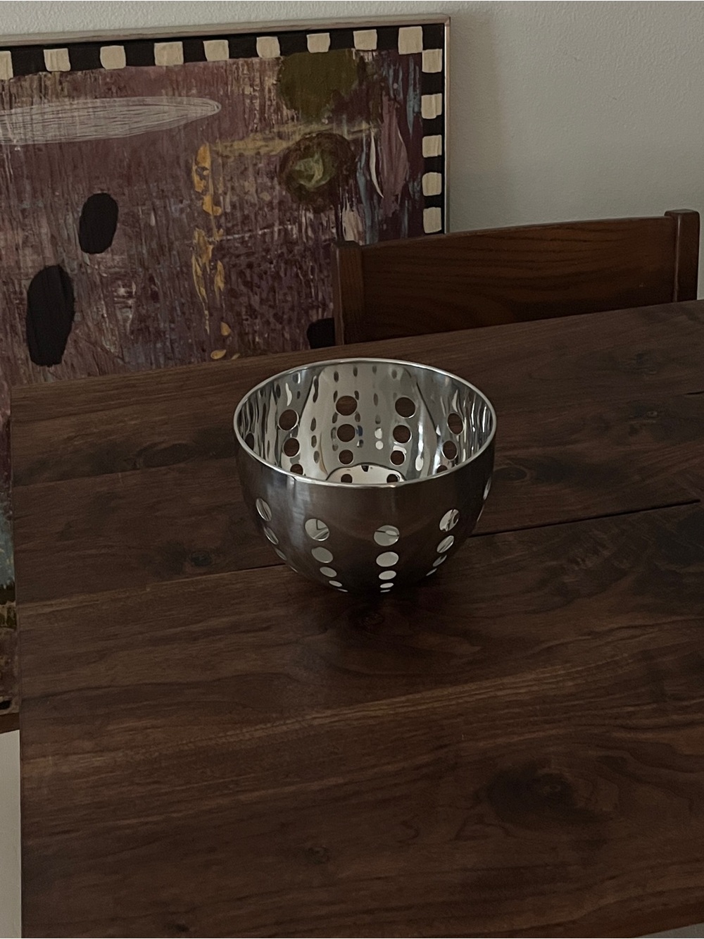 Vintage metal bowl with holes
